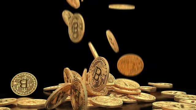 Gold bitcoins fall slow motion on pile. Falling golden coins on black background 4K slowmotion video with alpha channel. Cryptocurrency mining concept.