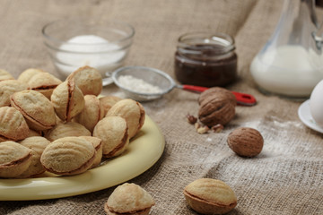 homemade cookies shaped nuts with cream boiled condensed milk on sackcloth