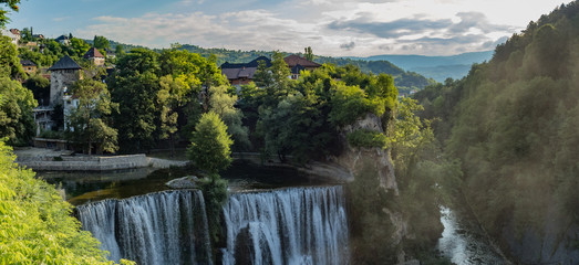 Beautiful enormous Jajce waterfall on the river Pliva