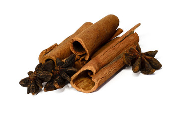 Whole cinnamon and corn snake isolated on white background. Spices for tea and mulled wine