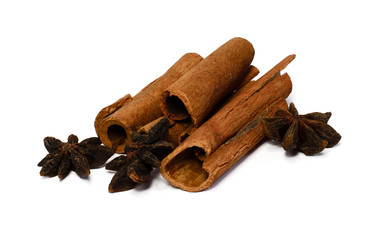 Whole cinnamon and corn snake isolated on white background. Spices for tea and mulled wine