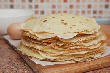 Stack of Homemade Pancakes Russian Pancakes or blini Slavic cuisine. Isolated. Wooden Backboard.