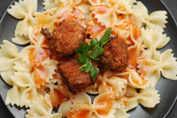 Clsoe Up of Farfalle Pasta with Meat Balls and Tomatoe Sauce. Health and homemade Food concept.