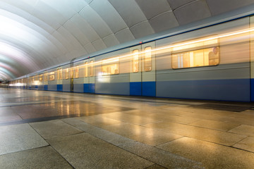 Subway metro train arriving at a station