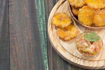 Patacón fried flattened pieces of green plantain (tostón, tachino)