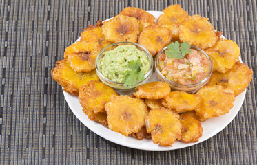Patacón fried flattened pieces of green plantain (tostón, tachino)