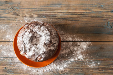 cake with raisins and dried fruits on a wooden table