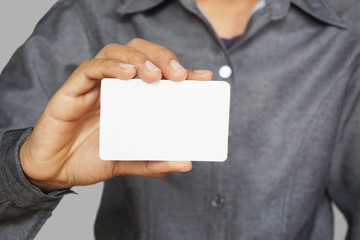 Man holding white business card