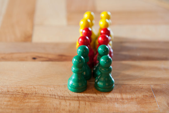 Colorfull game figurines on a wooden table