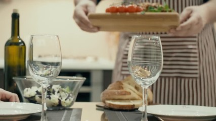 Man serving supper for romantic evening. Romantic concept .