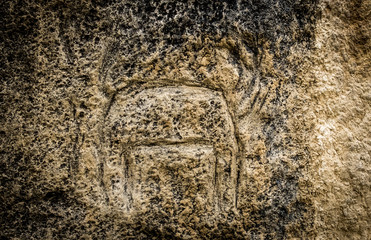 Obraz premium Ancient petroglyph of an animal in Gobustan National park. Exposition of Petroglyphs in Gobustan near Baku, Azerbaijan.