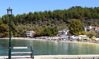 Fototapeta na wymiar THASSOS, GREECE- September 13, 2015: Beautiful view of Limenas beach, near old harbor in Thassos island, Greece
