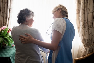 Nurse taking care of a senior woman