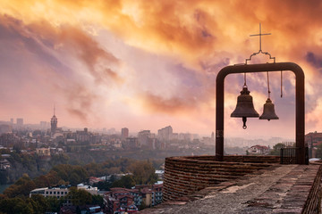 bells and beautiful view of Tbilisi from Narikala fortress, Georgia - obrazy, fototapety, plakaty
