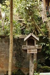 homemade Buddhist shrine made of timber standing in a village in Northern Thailand