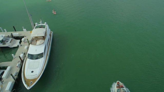 Aerial drone footage paddle boarding Miami Beach