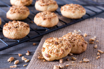 Freshly baked peanut butter cookies on cooling rack. Macro with extremely shallow dof.