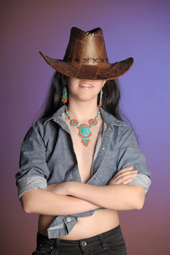 portrait of a brunette in a cowboy hat