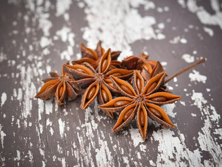 Spices. Anise stars on the vintage wooden surface