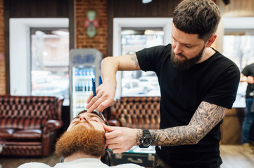 man getting trendy haircut at barber shop.