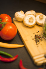 cooking ingredients on a black stone background