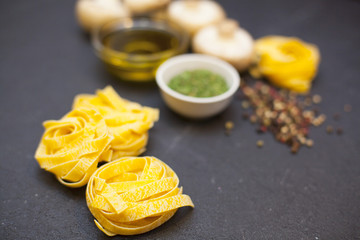 cooking ingredients on a black stone background
