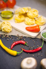 cooking ingredients on a black stone background