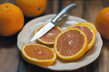 Sliced Delicious Sweet Oranges On A Plate