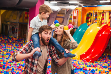 Happy little child have fun with his parents