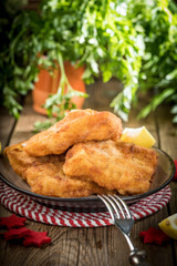Fried cod slices in breadcrumbs.