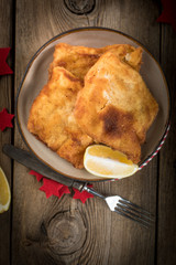 Fried cod slices in breadcrumbs.