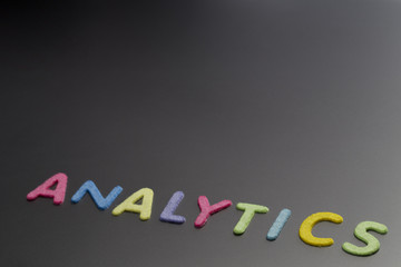 Analytics letters on black background