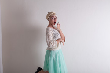 blonde from France posing in white dress