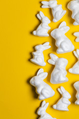 Easter bunny rabbits on a bright yellow background