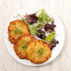 fried potato galette and salad