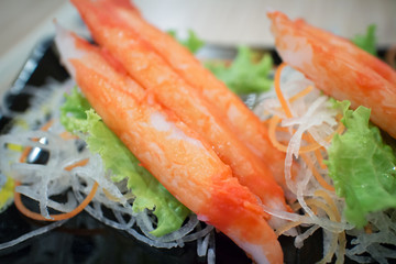 fresh crab stick with vegetables decorative on plate