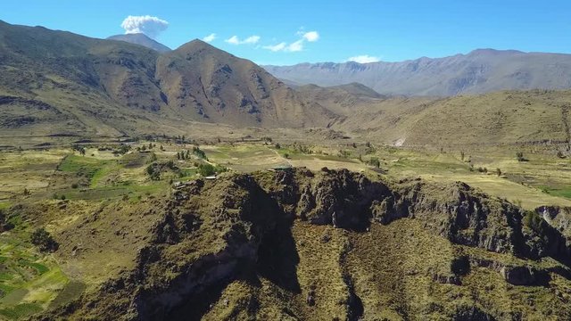 Incredible view of the Andes Mountains from a drone flying above the Colca Canyon Valley in Peru