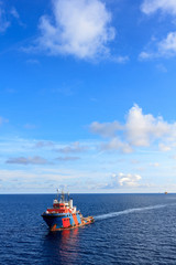 Offshore oil and gas supply boat approach to the platform for transfer passenger between supply...