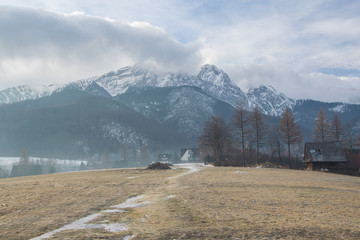 Scenic view of a wonderful valley in the mountains with rural farm house buildings