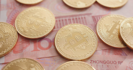 RMB banknote and bitcoin