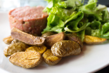 tasty Steak tartare (Raw beef) - classic steak tartare on white plate