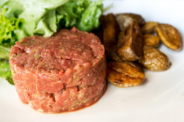 tasty Steak tartare (Raw beef) - classic steak tartare on white plate