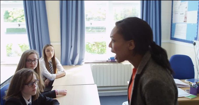 4K Disruptive schoolboy being yelled at by teacher & sent out of classroom. Slow motion
