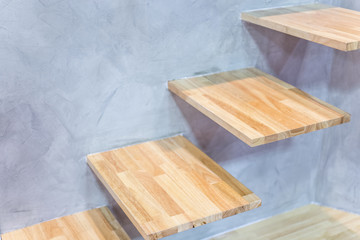 wodd stair or steps on a brick wall background