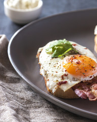 French toast with bacon and eggs closeup