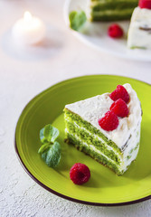 Spinach cake with cream and raspberry.