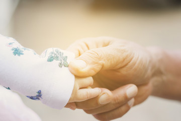 Hands of Fater and baby.