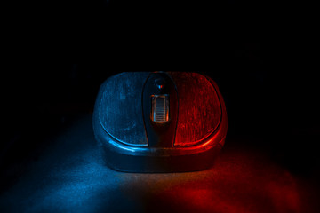 Computer mouse on a dark table. Gamer.