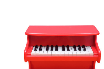 Kids red piano keyboard isolated on white with clipping path and copy space, Musical instrument for...