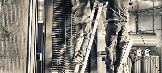 Obraz premium Men at work in a warehouse, vlurerd movements